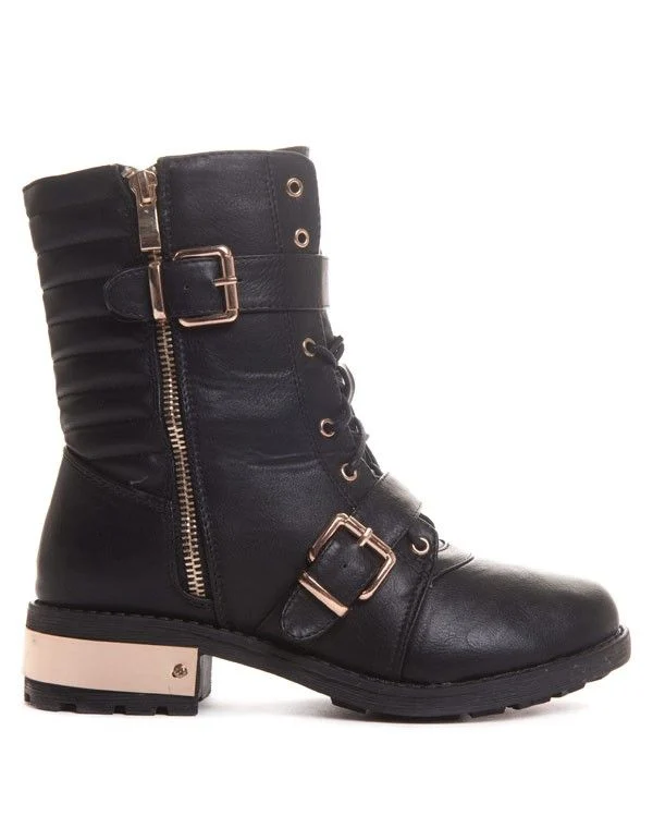 Boots godillot noire avec détails métalliques dorés