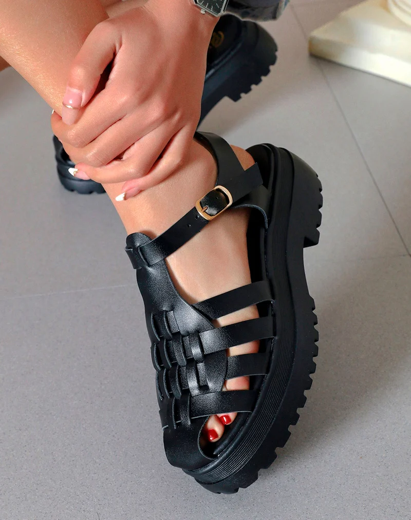Sandales noires semi-fermées à multiples brides et semelle crantée