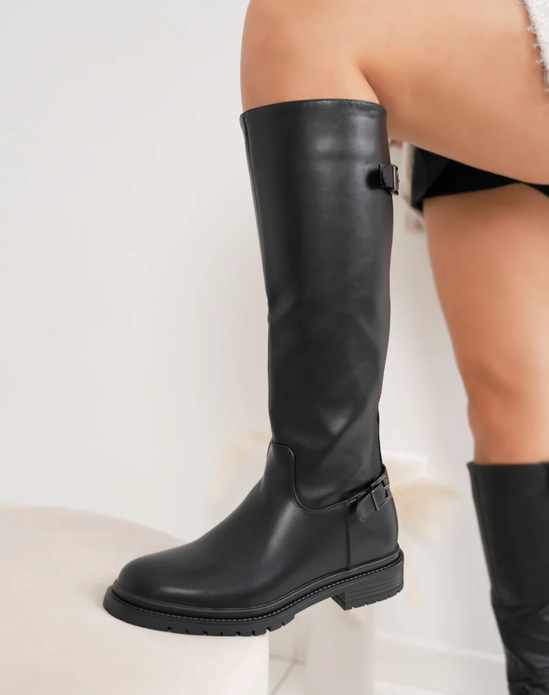 Bottes femme noires à élastique, semelle crantée et sangle décorative