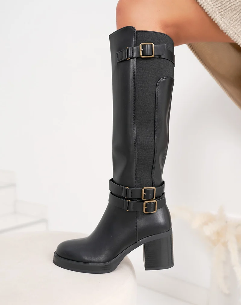 Bottes femme noires fourrées à talon épais, avec boucles dorées et élastique