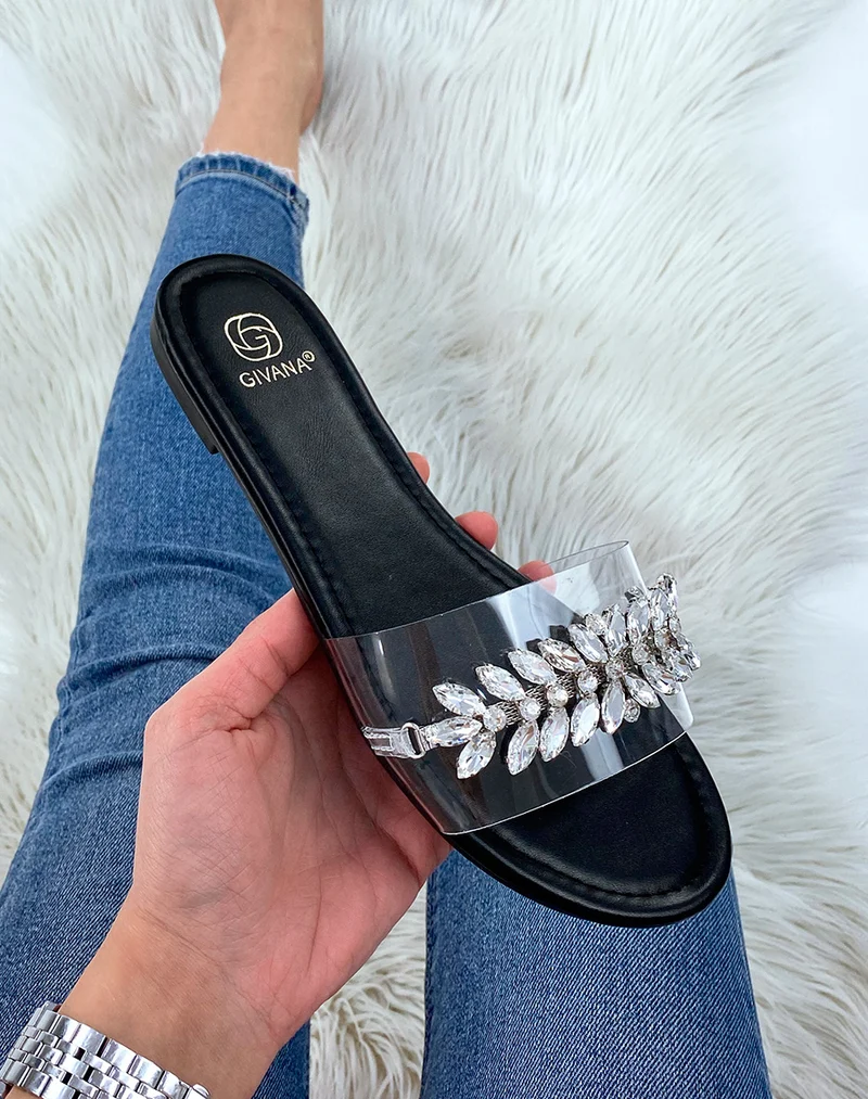 Mules plates noires à détail en bijou argenté en forme de feuille