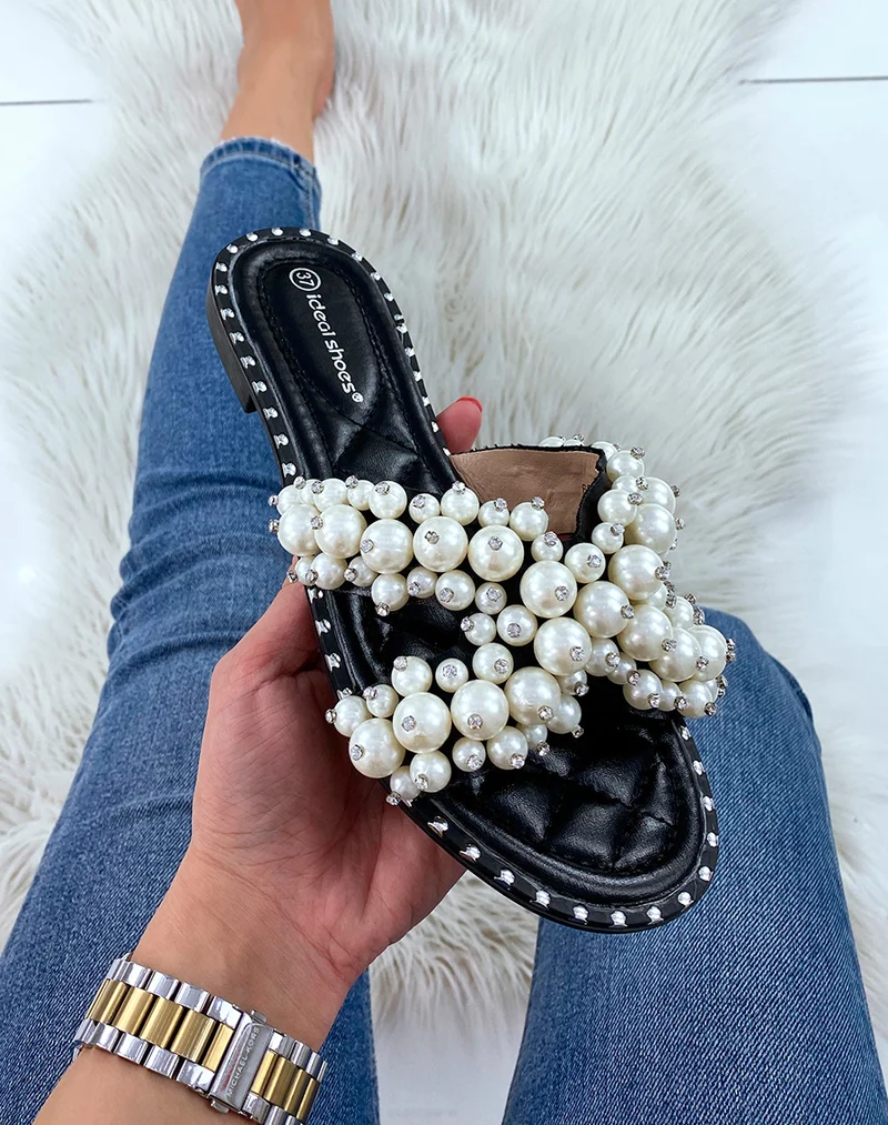 Mules noires à brides entrecroisées à perles