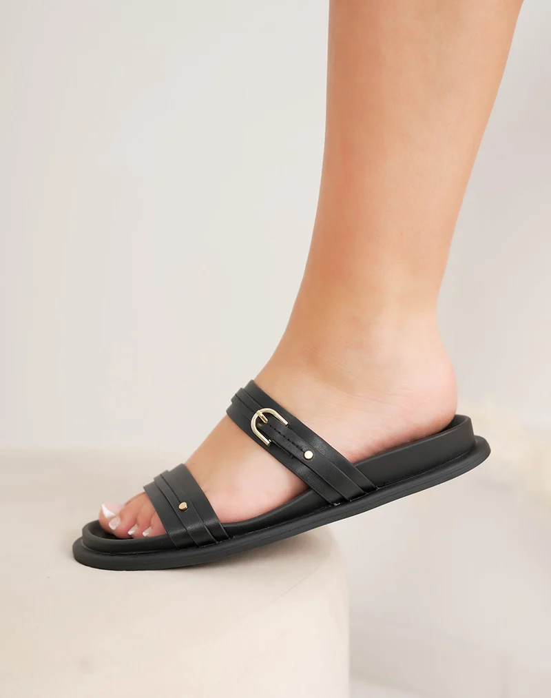 Mules plates femme noires élégantes à brides fines et boucles dorées