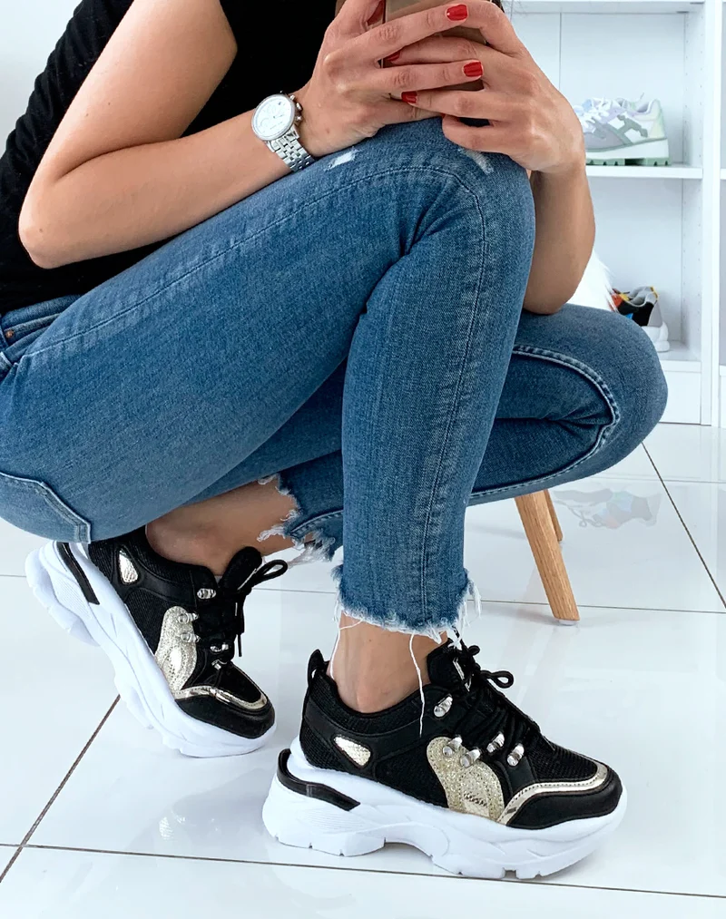 Baskets noires à empiècement doré et bande sur talon