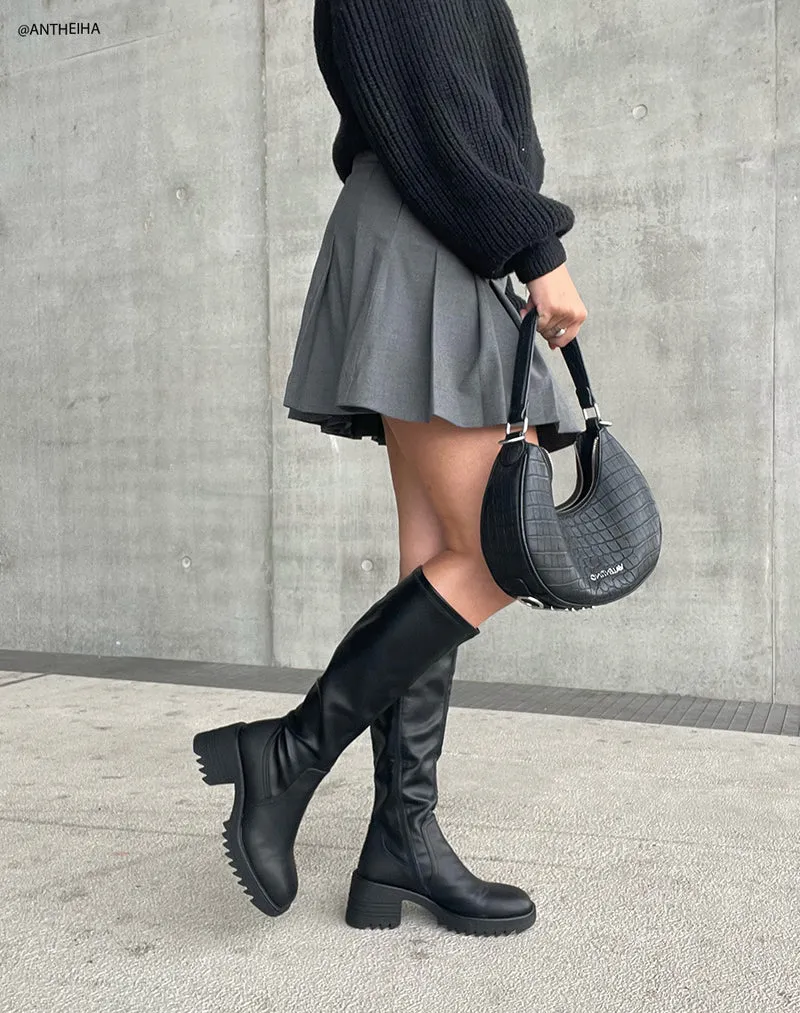 Bottes noires à bout carré et talon épais à semelle crantée