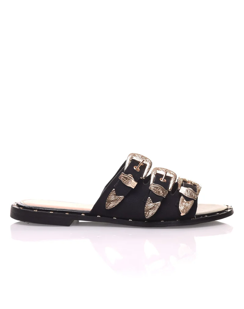Mules noires avec boucles dorées