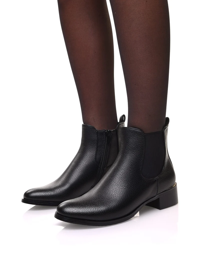 Chelsea boots noires à liseré doré